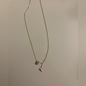 NWOT Rose Gold Evil eye and cross necklace. 16” length. Comes with box.